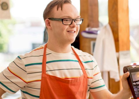 Disabled store clerk at point of sale.