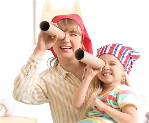 woman and child playing pirate dress up
