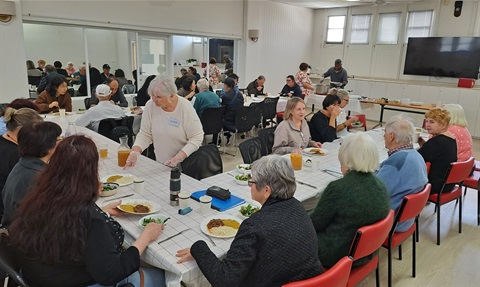 People having a community lunch