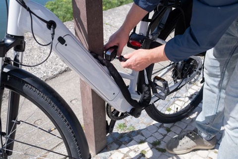 E-bike being locked to a pole